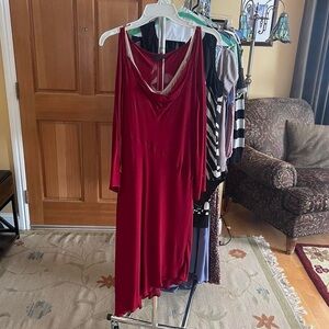 Red midi dress with a flowy, fairy-like design. Comes with nude slip dress